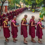 Buddhist monks lining up to receive their last meal of the day | Photo taken by Tack S