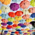 Walk way to the beach under a sea of umbrellas  | Photo taken by Barbara D