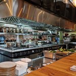 We snagged a coveted reservation at the bar surrounding the open kitchen at Claro. We had "front row seats" to watch our magnificent meal (specialty cocktail, two bottles of sparkling water, a bottle of a French Sancerre white wine, a starter of steak tartare each, a main course of smoked trout for me and grouper fish with crème fraiche for Brad, a complimentary side dish of asparagus and goat cheese burrata, a complimentary coriander-lemon shot, and dessert) being prepared. The meal was truly a delight and a highlight of our time in Israel.  - Tel Aviv, Israel | Photo taken by Rich W