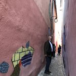 The narrowest street in Europe, artistically decorated by young artists  | Photo taken by Anne L