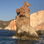 After snorkeling, we set sail again and dine on a delicious lunch of fresh fish, greek salads, and other greek culinary delights.  We pass this huge, cool lava rock formation in the shape of a bear. | Photo taken by Kris M