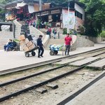 No cars, so when the train arrives to restock the restaurants, these guys don’t waste any time | Photo taken by Matt M