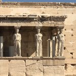 The Erechtheum temple was built on the north-side of the Parthenon and was dedicated to Athena and Poseidon. The 6 draped female columns are called the Porch of the Maidens. | Photo taken by Kris M