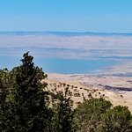 Mount Nebo is where God allowed Moses to see the Promised Land of Israel, but not to enter it because of Aaron’s and his disobeying God’s command about speaking to the rock to issue water for the wandering tribe.  In this photo, taken from Mount Nebo (near Ma’an, Jordan), the Dead Sea is the mid-ground, and Israel – the Promised Land – is in the distance. | Photo taken by Rich W
