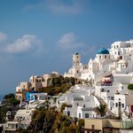 Oia's cliffside stucco and blue domes | Photo taken by David B