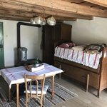 Our room with an extra bed we did not use and small stove for heat | Photo taken by Anne L