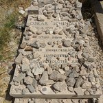 Oskar Schindler is credited with saving the lives of 1,200 Jews during the Holocaust, and he is buried in the cemetery not far from David’s Tomb.   After walking down a couple of levels in the cemetery, we found his grave-site crowded with small stones. In Jewish custom, placing a rock or pebble on the tombstone honors the deceased by letting people know that the grave-site has recently been visited. Given the number of Jewish children that Schindler saved during the Holocaust, it’s no surprise that his grave-site is filled with such stones.  - Oskar Schindler's grave, Jerusalem, Israel | Photo taken by Rich W