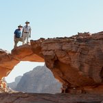 The next morning, we went on a 4x4 tour of the Wadi Rum desert. First, we climbed one of the many rocky outcroppings in the area to pose on the natural bridge.  - Wadi Rum, Jordan | Photo taken by Rich W