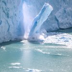 A chunk of ice falling off a glacier near El Calafate